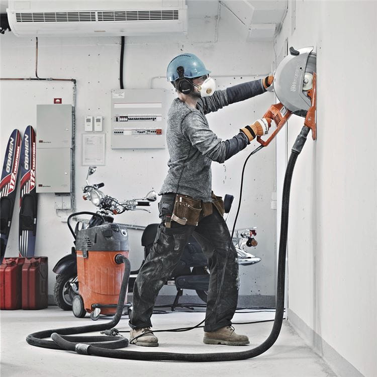 Dry cutting with handheld electric cut-off concrete saw Husqvarna K 3000 power cutter enables excellent dust collection.